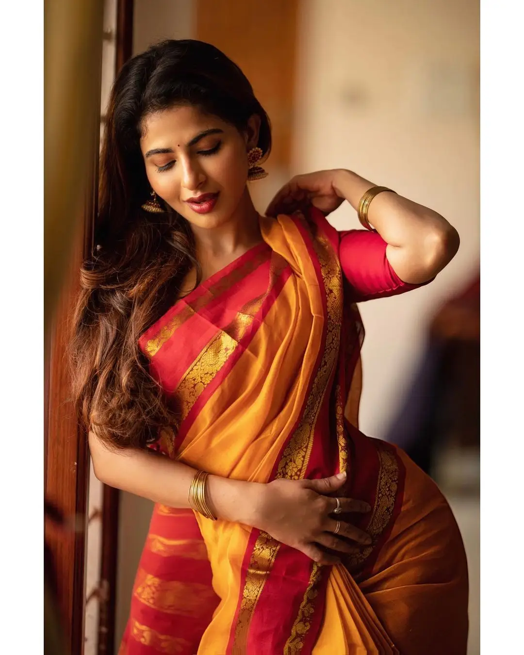 Indian Girl Iswarya Menon In Traditional Orange Saree Sleeveless Blouse